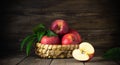 Rustic healthy red apples in a bascket on wooden background Royalty Free Stock Photo