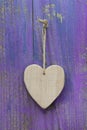 Rustic heart on purple wooden surface for valentine, birthday, m