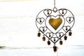 rustic heart shaped metal decoration hanging with white background