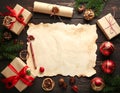 Frame with vintage paper and Christmas decorations on wooden background Royalty Free Stock Photo