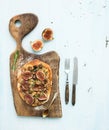 Rustic homemade pizza with figs, prosciutto and
