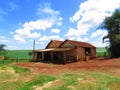 Rustic house that was converted to shed at countryside with blue sky Royalty Free Stock Photo