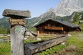 rustic house and water trough in Neustatt valley in Austrian Alps in Dachstein region (Styria, Austria)