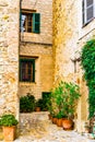 Rustic houses and narrow alley in an old mediterranean village Royalty Free Stock Photo