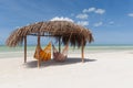 A rustic hut with hammocks on a tropical beach Royalty Free Stock Photo