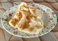 Rustic indian roti paratha fried pancake on wooden table Royalty Free Stock Photo