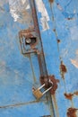 Rustic iron door with closed padlock Royalty Free Stock Photo