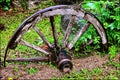 Rustic iron and wooden wagon wheel Royalty Free Stock Photo