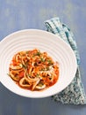 Rustic italian calamari in spicy tomato sauce