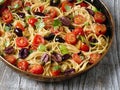 Rustic italian spaghetti puttanesca pasta Royalty Free Stock Photo
