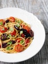 Rustic italian spaghetti puttanesca pasta Royalty Free Stock Photo