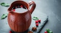 Rustic jug with water and cranberries on dark stone tabletop Royalty Free Stock Photo