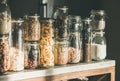 Rustic kitchen food storage arrangement over kitchen counter