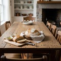Rustic kitchen interior with a large wooden dining table set for Royalty Free Stock Photo