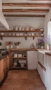 A rustic kitchen with open shelving terracotta flooring and lavender decor. Royalty Free Stock Photo