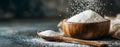 In a rustic kitchen setting, a wooden bowl containing granulated white sugar and a spoon is captured with natural Royalty Free Stock Photo
