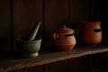 Rustic Kitchen Still Life with Mortar Pestle and Clay Pottery Royalty Free Stock Photo