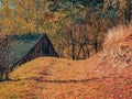 Rustic landscape with an abandoned old wooden house or shelter in the Carpathain Mountains, Romania. Autumn landscape Royalty Free Stock Photo