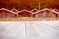 Rustic landscape wooden houses hill forest sky. Royalty Free Stock Photo