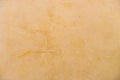 Rustic light brown colored stucco wall background texture, close-up Royalty Free Stock Photo