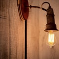 Vintage, rustic lamp fixture bulb on wood, blur and bokeh smooth