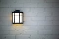 Rustic light fixture on white brick wall background