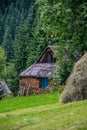 Rustic log cabin by the green forest Royalty Free Stock Photo