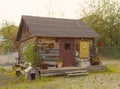 A rustic log cabin at an outdoor museum in yellowknife Royalty Free Stock Photo