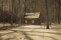 Rustic cabin in snowy woods in Michigan in sepia Royalty Free Stock Photo