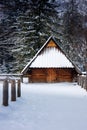Rustic Log Cabin in Snowy Woods Royalty Free Stock Photo