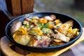 Rustic lunch in iron pan outdoor