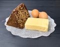 A rustic lunch on the table, cheese, brown bread.