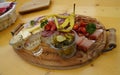 a rustic meal of cheeses, cold cuts and schnaps in the Austrian Alps (Tannheimer Valley in Austria)