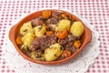 rustic meal of ox tail with potato and carrot