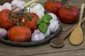 Rustic mediterranean cuisine still life with tomatoes and garlic