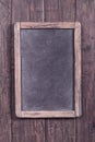 Rustic menu blackboard on wooden wall Royalty Free Stock Photo