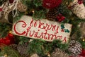 Rustic Merry Christmas Sign in Tree Royalty Free Stock Photo