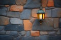 rustic metal lantern on stone wall at dusk Royalty Free Stock Photo
