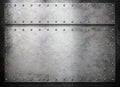 Rustic metal plates over dark background Royalty Free Stock Photo