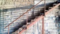 rustic metal staircase, highlights the shadow of the steps reflected on the wall Royalty Free Stock Photo