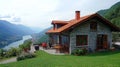 Rustic mountain chalet overlooking a scenic valley Royalty Free Stock Photo