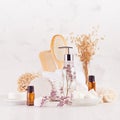Rustic natural cosmetic products and accessories for skin and body care, aromatherapy and relaxation with lavender twig on white. Royalty Free Stock Photo