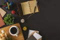 Rustic notepad, pen and coffee on black background. Royalty Free Stock Photo