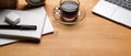 Rustic office desk with coffee cup, laptop, schedule books, pen and decorations on wooden table Royalty Free Stock Photo