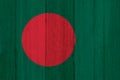 A rustic old Bangladesh flag on weathered wood