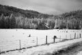 Rustic old barn in a snowy winter landscape with copy space. Royalty Free Stock Photo