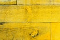 Rustic old grungy and weathered yellow wall wooden planks as wood texture Royalty Free Stock Photo