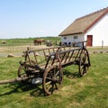 Rustic Old Horse Drawn Wagon with young goat resting in his shadow Royalty Free Stock Photo