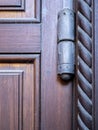 Rustic old metal door hinge in close-up view Royalty Free Stock Photo