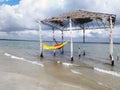 Rustic and old tent with hammock inside the beach. Deserted beach of Mangue Seco; Jandaira; Bahia; Brazil